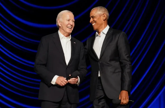 Biden freezes as Obama grabs his arm and leads him off stage