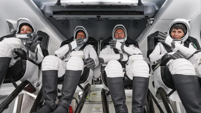 NASA astronauts return from space station on SpaceX capsule